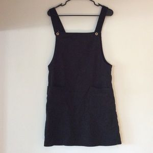 Woman’s black overall dress